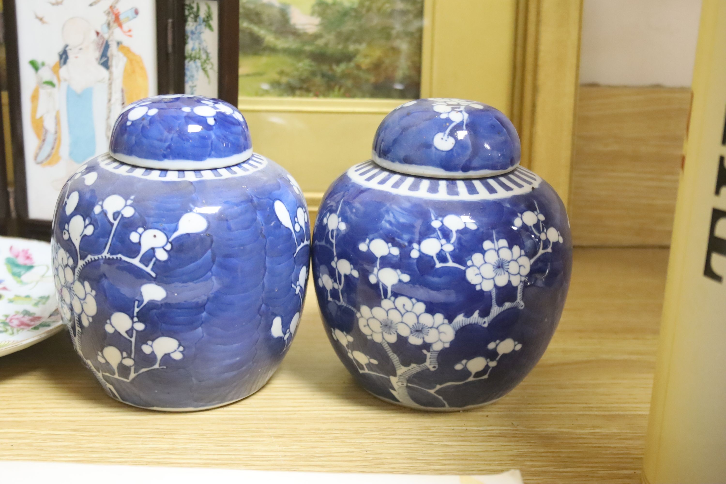 A Chinese miniature porcelain screen, a pair of jars, plate and folio of woodblock prints